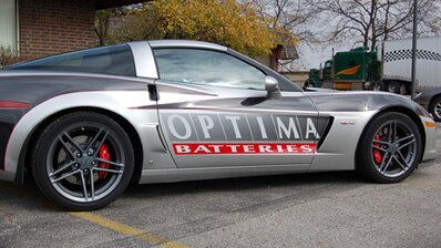 Signage vinyl tastefully applied to a grey car, featuring promotional messages, brand logos, or custom designs, adding a dynamic and eye-catching element to the vehicle's appearance. | © Scandraft AB